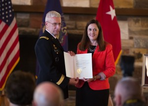 Sen. Lisa Baker receives her Pennsylvania Department of Military and Veterans Affairs Hall of Fame certificate from Maj. Gen. Wesley E. Craig, the state's adjutant general.